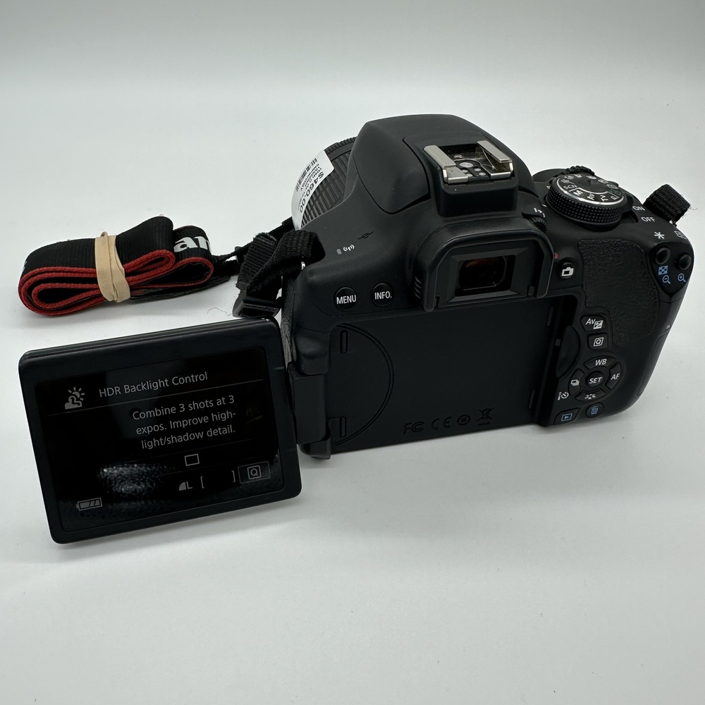 Canon EOS Rebel T6i DSLR Camera & lens.
